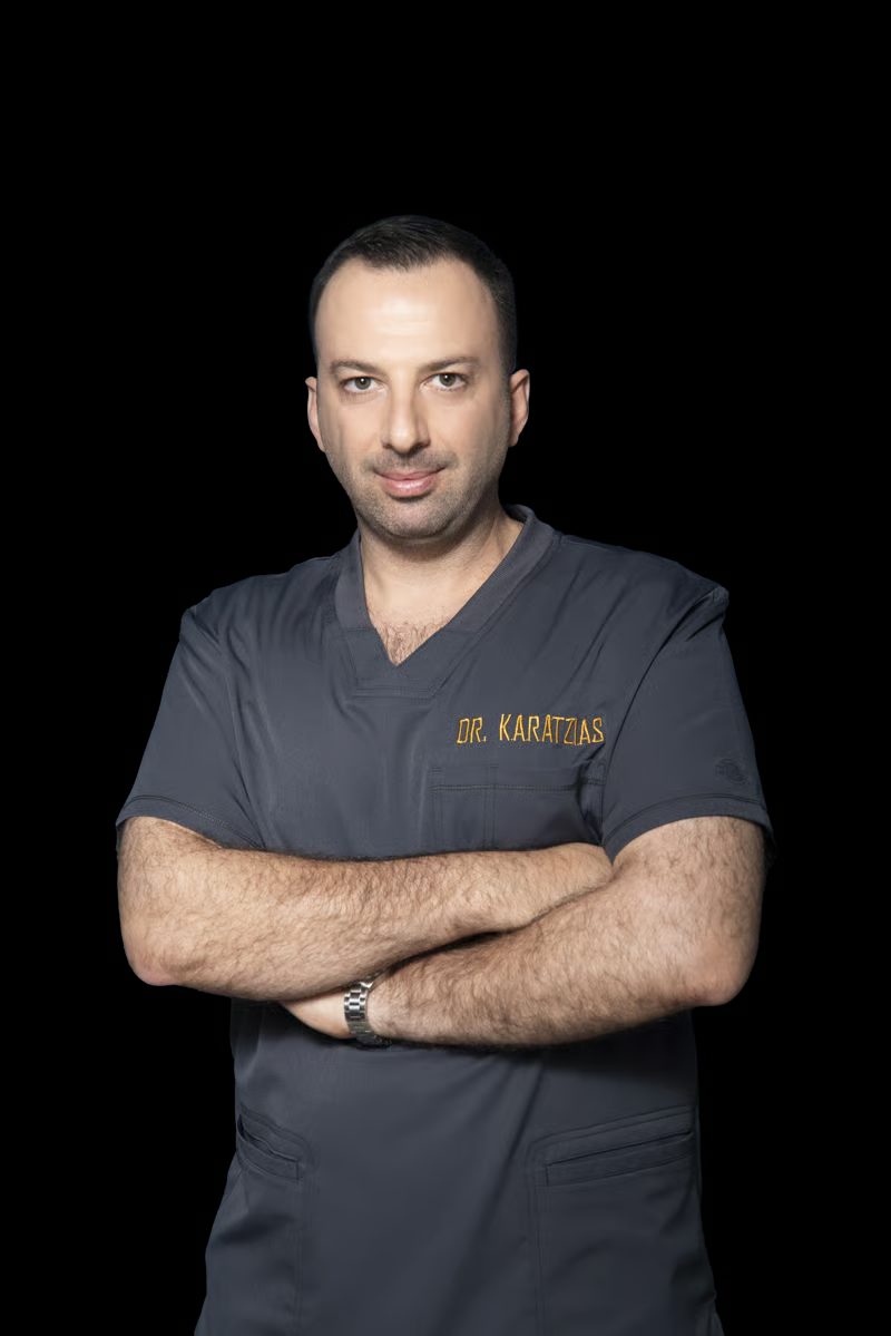 Dr. Angelos Karatzias in surgical scrubs